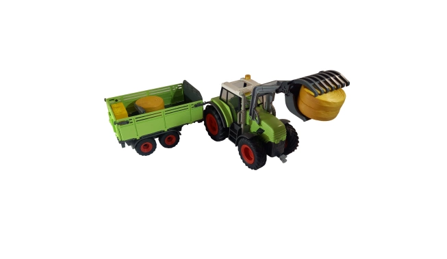 Photo du tracteur avec sa remorque et ses accessoires